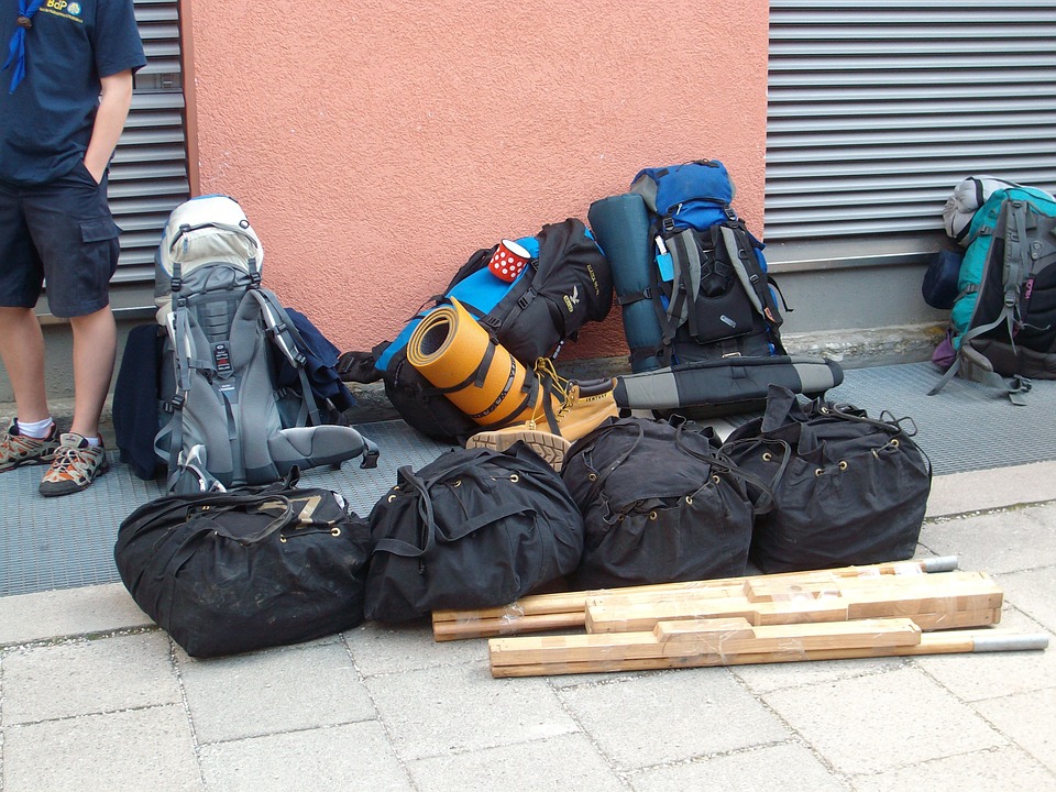 A pile of travel backpacks